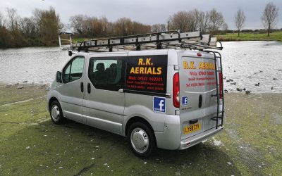 The company work van pictured on the side of a lake